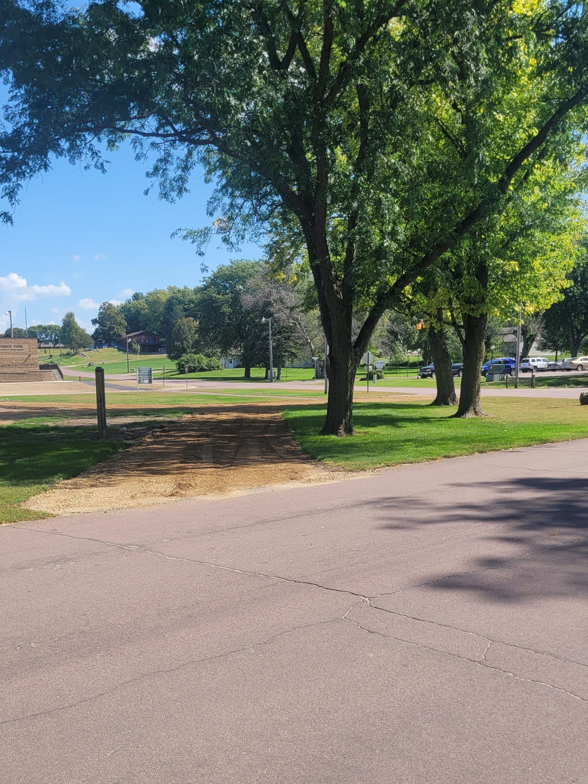 campground site 42 with a gravel path, trees, and green grass